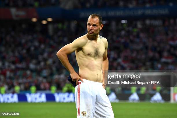 Sergey Ignashevich of Russia shows his dejection following his team's defeat in the 2018 FIFA World Cup Russia Quarter Final match between Russia and...