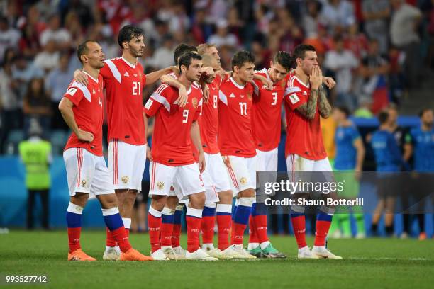 Russia players watch the penalty shoot out during the 2018 FIFA World Cup Russia Quarter Final match between Russia and Croatia at Fisht Stadium on...