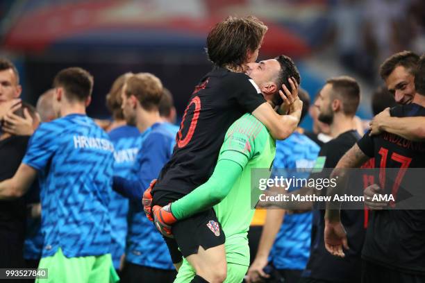 Danijel Subasic of Croatia celebrates with Luka Modric of Croatia after their victory in a penalty shootout during the 2018 FIFA World Cup Russia...