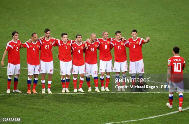 Russia players encourage Fedor Smolov after the missed penalty part of the penalty shoot out during the 2018 FIFA World Cup Russia Quarter Final...