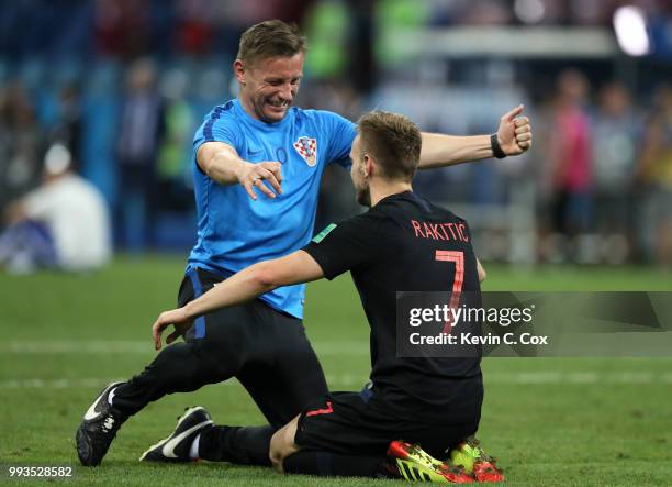 Ivan Rakitic of Croatia celebrates with a Croatia staff member following his sides victory in the 2018 FIFA World Cup Russia Quarter Final match...