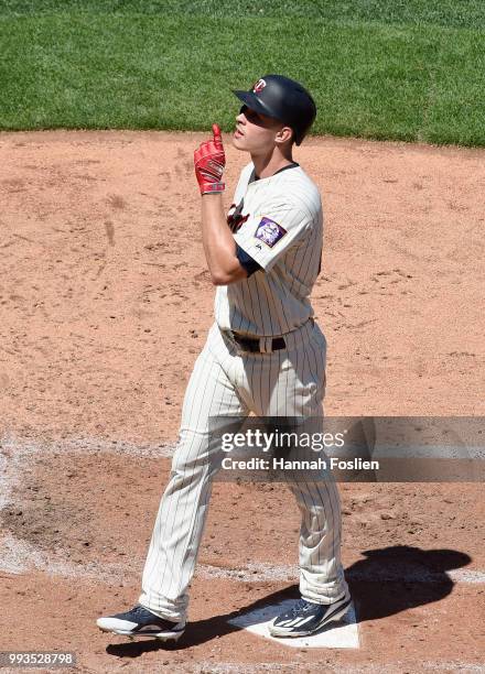 Max Kepler of the Minnesota Twins celebrates hitting a solo home run as he crosses home plate against the Baltimore Orioles during the fifth inning...