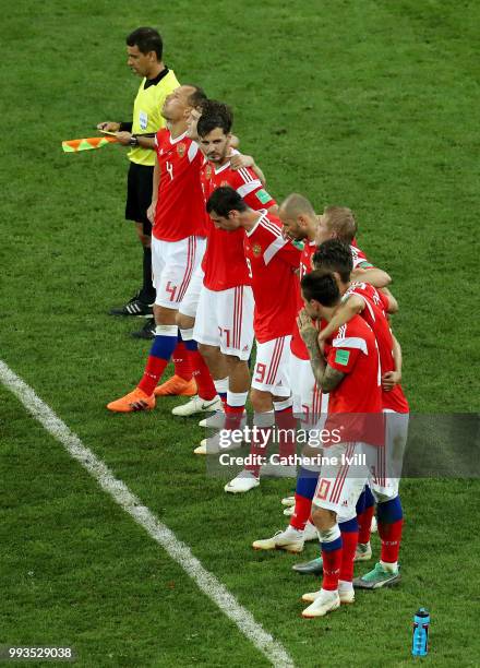 Russia players watch the penalty shoot out during the 2018 FIFA World Cup Russia Quarter Final match between Russia and Croatia at Fisht Stadium on...