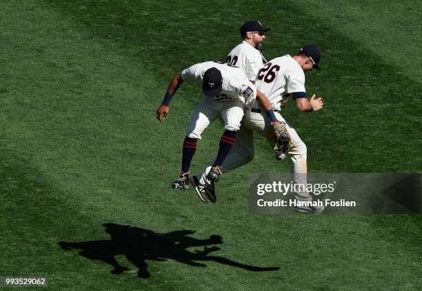 Eddie Rosario, Jake Cave and Max Kepler of the Minnesota Twins celebrate defeating the Baltimore Orioles after the game on July 7, 2018 at Target...