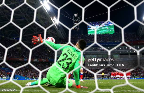 Danijel Subasic of Croatia saves the first penalty from Fedor Smolov of Russia in the penalty shoot out during the 2018 FIFA World Cup Russia Quarter...