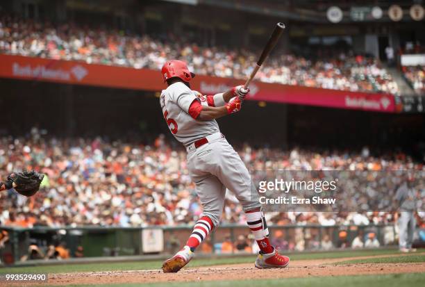 Dexter Fowler of the St. Louis Cardinals hits a sacrifice fly that scored a run in the fourth inning against the San Francisco Giants at AT&T Park on...