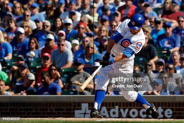 Ben Zobrist of the Chicago Cubs hits a two run RBI double against the Cincinnati Reds during the eighth inning at Wrigley Field on July 7, 2018 in...