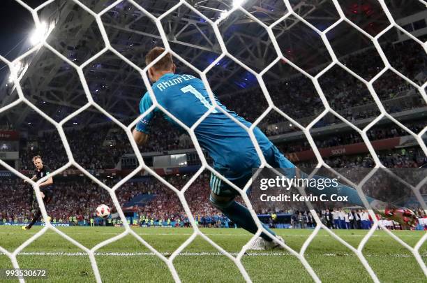 Ivan Rakitic of Croatia scores the fifth, and the winning penalty past Igor Akinfeev of Russia in the penalty shoot out during the 2018 FIFA World...