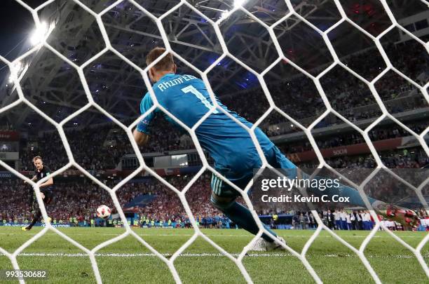 Ivan Rakitic of Croatia scores his sides winning penalty in the penalty shoot out past Igor Akinfeev of Russia during the 2018 FIFA World Cup Russia...