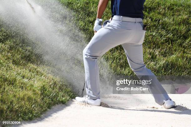 Xander Schauffele holes out from the bunker on the 17th hole during round three of A Military Tribute At The Greenbrier held at the Old White TPC...