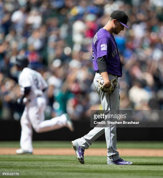 Starting pitcher Kyle Freeland of the Colorado Rockies reacts after giving up solo home run to Jean Segura of the Seattle Mariners during the fifth...