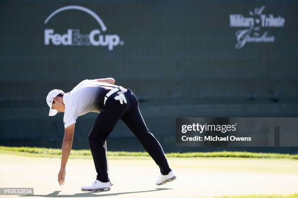 Whee Kim of Korea finishes the round on the 18th hole during round three of A Military Tribute At The Greenbrier held at the Old White TPC course on...