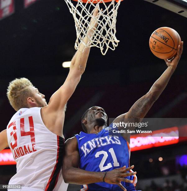 Damyean Dotson of the New York Knicks shoots a layup against Jock Landale of the Atlanta Hawks during the 2018 NBA Summer League at the Thomas & Mack...