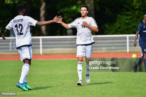 Younes Kaabouni of UNFP is congratulated on his goal during the pre-season friendly match between Paris FC and UNFP on July 7, 2018 in Paris, France.