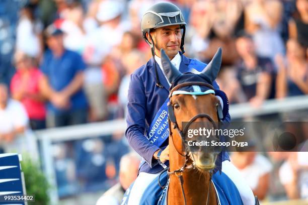 Sameh El Dahan riding Suma's Zorro celebrates winning the Global Champions Tour Grand Prix of Paris at Champ de Mars on July 7, 2018 in Paris, France.