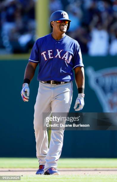 Adrian Beltre of the Texas Rangers can reacts after JaCoby Jones of the Detroit Tigers reached above the left-center field fence to catch his fly...