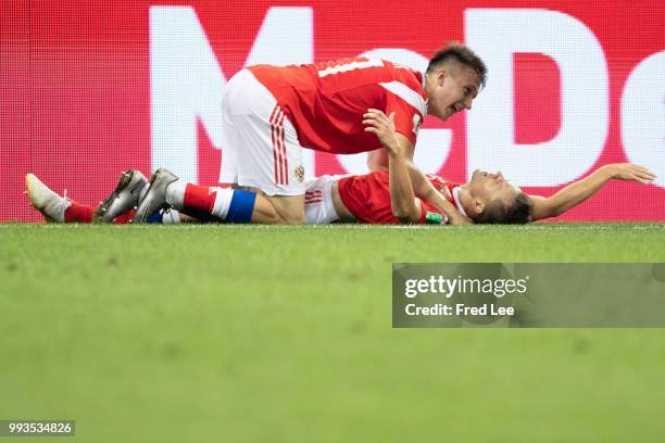 Denis Cheryshev of Russia celebrates scoring a goal to make it 1-0 with Roman Zobnin of Russia during the 2018 FIFA World Cup Russia Quarter Final...