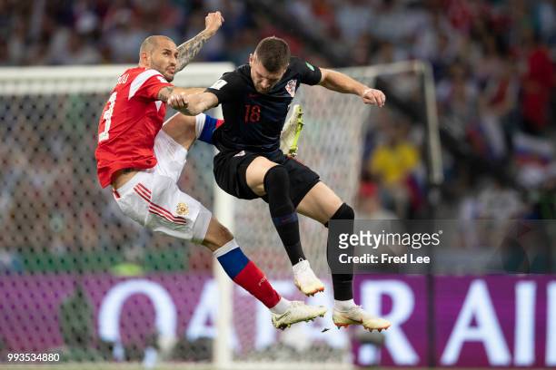 Ante Rebic of Croatia fights for the ball with Fedor Kudryashov of Russia during the 2018 FIFA World Cup Russia Quarter Final match between Russia...