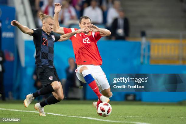 Artem Dzyuba of Russia fights for the ball with Josip Pivaric of Croatia during the 2018 FIFA World Cup Russia Quarter Final match between Russia and...