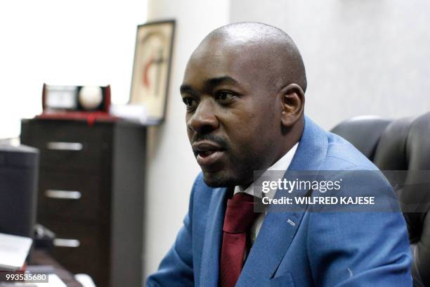 Zimbabwe opposition leader and President of The Movement for Democratic Change , Nelson Chamisa gestures during an interview with AFP in Harare, on...