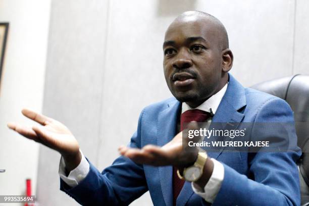 Zimbabwe opposition leader and President of The Movement for Democratic Change , Nelson Chamisa gestures during an interview with AFP in Harare, on...