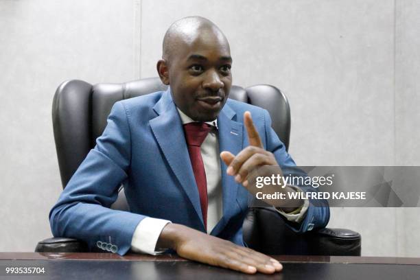 Zimbabwe opposition leader and President of The Movement for Democratic Change , Nelson Chamisa gestures during an interview with AFP in Harare, on...