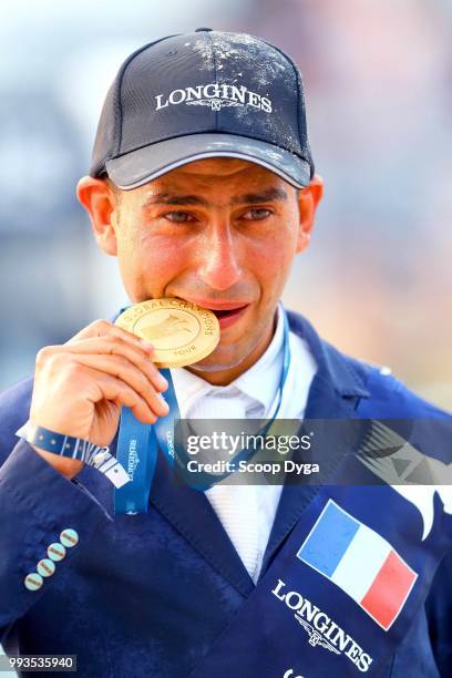 Sameh El Dahan riding Suma's Zorro celebrates winning the Global Champions Tour Grand Prix of Paris at Champ de Mars on July 7, 2018 in Paris, France.