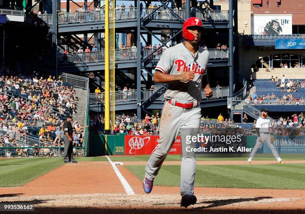 Nick Williams of the Philadelphia Phillies scores on a RBI single in the seventh inning against the Pittsburgh Pirates at PNC Park on July 7, 2018 in...