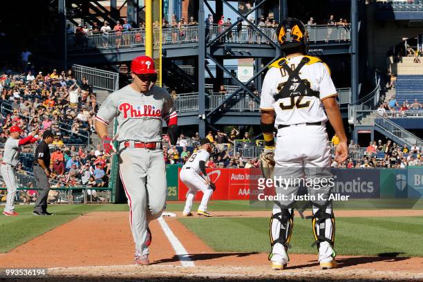Scott Kingery of the Philadelphia Phillies scores on a RBI double in the seventh inning against the Pittsburgh Pirates at PNC Park on July 7, 2018 in...