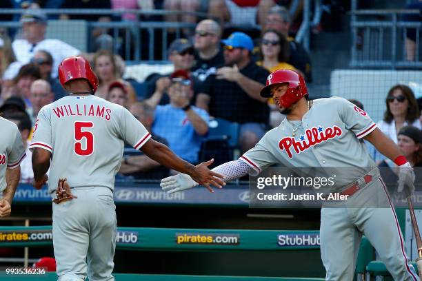 Nick Williams of the Philadelphia Phillies celebrates with Jorge Alfaro after scoring on a RBI single in the seventh inning against the Pittsburgh...