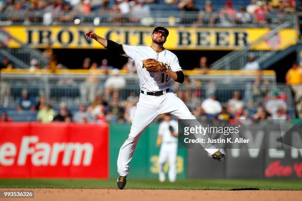 Jordy Mercer of the Pittsburgh Pirates records a put out in the eighth inning against the Philadelphia Phillies at PNC Park on July 7, 2018 in...