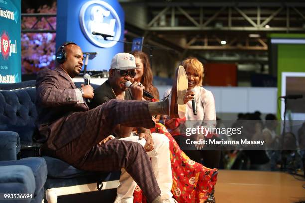 Bobby Brown and his wife Alicia Brown on stage with hosts Cayman Kelly and Michel Wright during SiriusXM's Heart & Soul Channel Broadcasts from...
