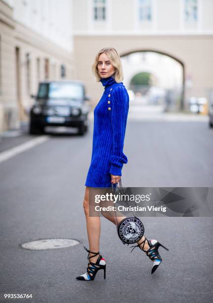 Lisa Hahnbueck wearing blue knit dress Balmain, round Balmain bag, Louis Vuitton high heels during the Berlin Fashion Week July 2018 on July 6, 2018...