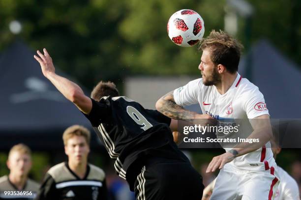 Klaas Jan Huntelaar of Ajax, Mihai Balasa of Steaua Bucharest during the Club Friendly match between Ajax v Steaua Bucharest at the Sportpark 't...