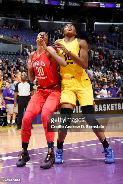 LaToya Sanders of the Washington Mystics and Nneka Ogwumike of the Los Angeles Sparks box out during the game between the two teams on July 7, 2018...