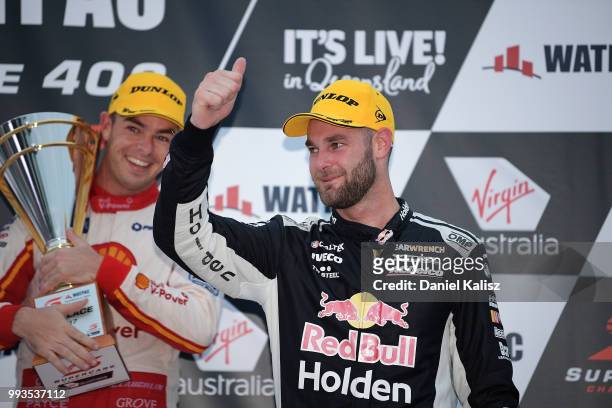 Shane Van Gisbergen driver of the Red Bull Holden Racing Team Holden Commodore ZB celebrates on the podium during race 17 of the Supercars Townsville...