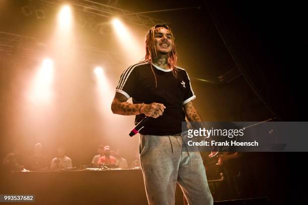 American rapper Tekashi 6ix9ine performs live on stage during a concert at the Huxleys on July 7, 2018 in Berlin, Germany.