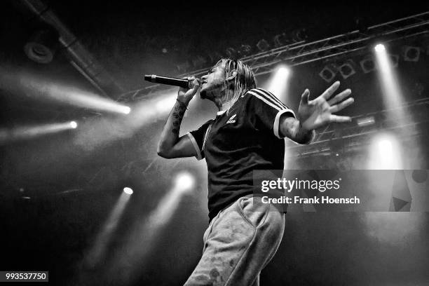 American rapper Tekashi 6ix9ine performs live on stage during a concert at the Huxleys on July 7, 2018 in Berlin, Germany.