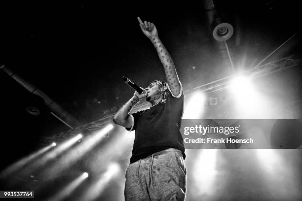 American rapper Tekashi 6ix9ine performs live on stage during a concert at the Huxleys on July 7, 2018 in Berlin, Germany.