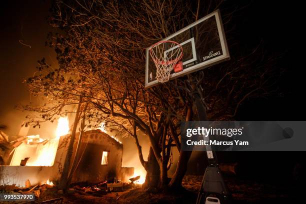 Wildfire destroy homes in Goleta, Calif., on July 7, 2018.