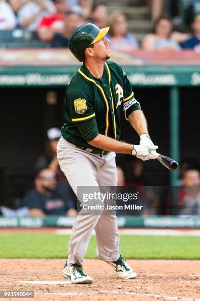 Stephen Piscotty of the Oakland Athletics hits a two run home run during the eleventh inning against the Cleveland Indians at Progressive Field on...