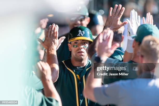 Khris Davis of the Oakland Athletics celebrates after hitting a solo home run to tie the game during the eighth inning against the Cleveland Indians...