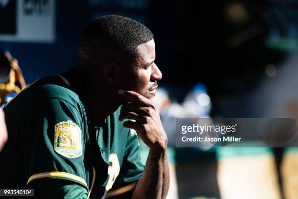 Starting pitcher Edwin Jackson of the Oakland Athletics sits in the dugout after leaving the game during the sixth inning against the Cleveland...