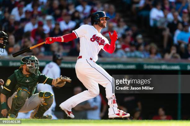 Tyler Naquin of the Cleveland Indians hits a single during the sixth inning against the Oakland Athletics at Progressive Field on July 7, 2018 in...