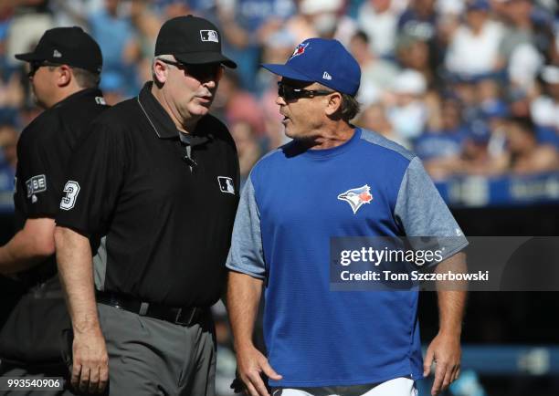 Manager John Gibbons of the Toronto Blue Jays argues with second base umpire and crew chief Bill Welke after being ejected in the third inning during...