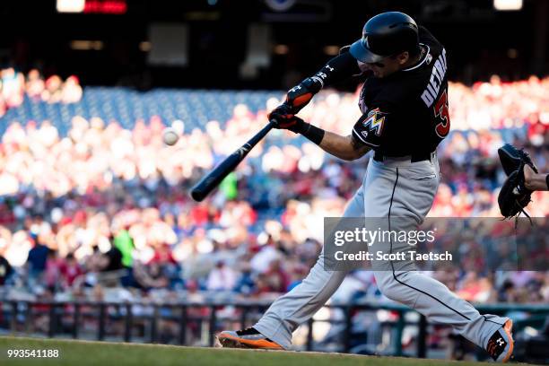 Derek Dietrich of the Miami Marlins singles during the first inning against the Washington Nationals at Nationals Park on July 07, 2018 in...