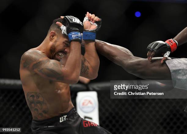 Max Griffin blocks a kick from Curtis Millender in their welterweight fight during the UFC 226 event inside T-Mobile Arena on July 7, 2018 in Las...