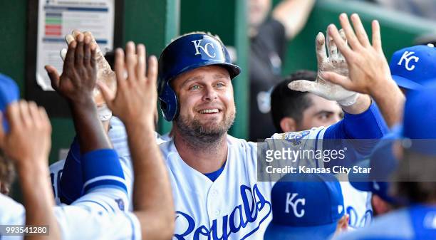 The Kansas City Royals' Lucas Duda is congratulated after hitting a solo home run in the first inning against the Boston Red Sox at Kauffman Stadium...