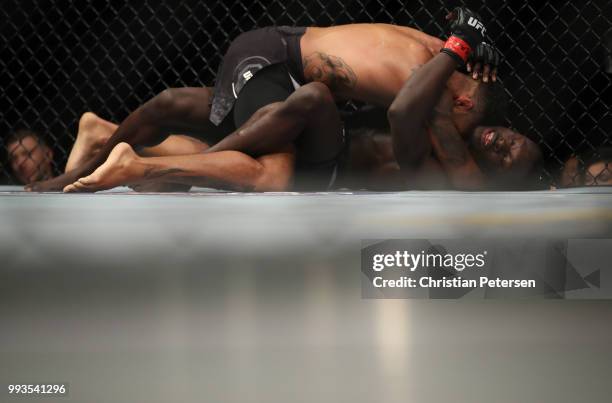 Max Griffin controls the body of Curtis Millender in their welterweight fight during the UFC 226 event inside T-Mobile Arena on July 7, 2018 in Las...