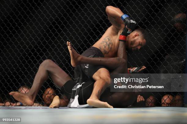 Max Griffin controls the body of Curtis Millender in their welterweight fight during the UFC 226 event inside T-Mobile Arena on July 7, 2018 in Las...